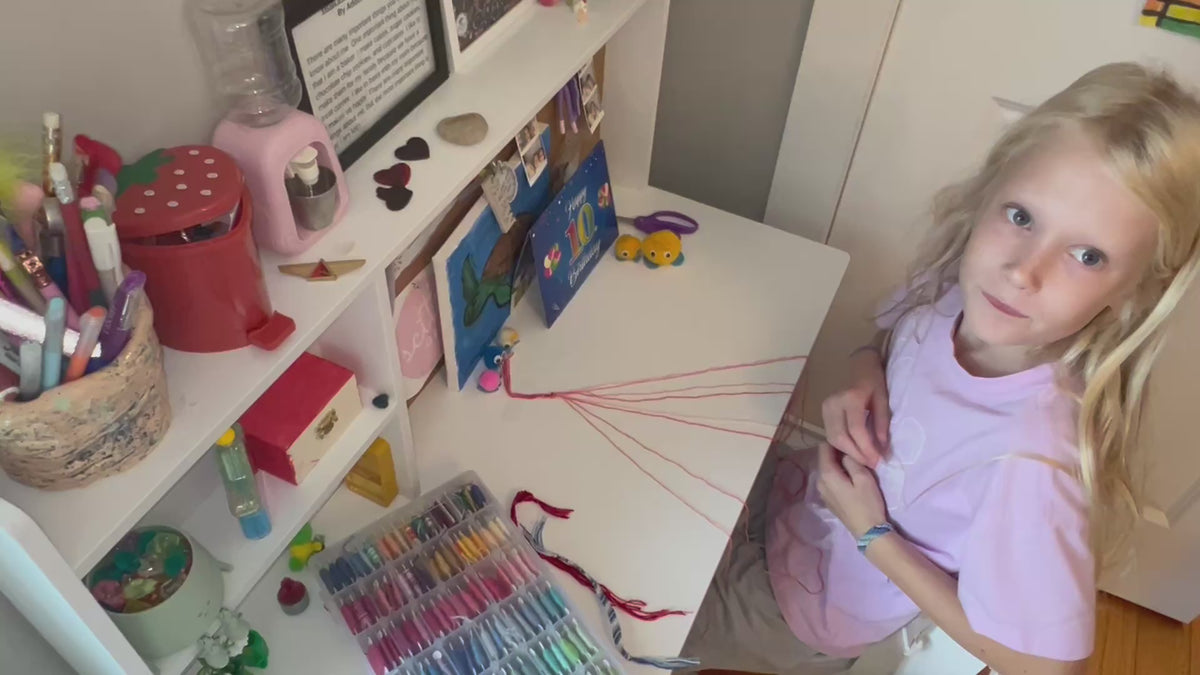 Load video: Addison demonstrating how to make a Hope Bracelet